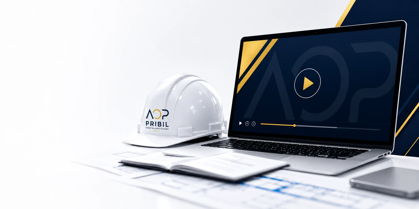 Ordinateur portable et casque de chantier présentant l’Académie AOP Pribil